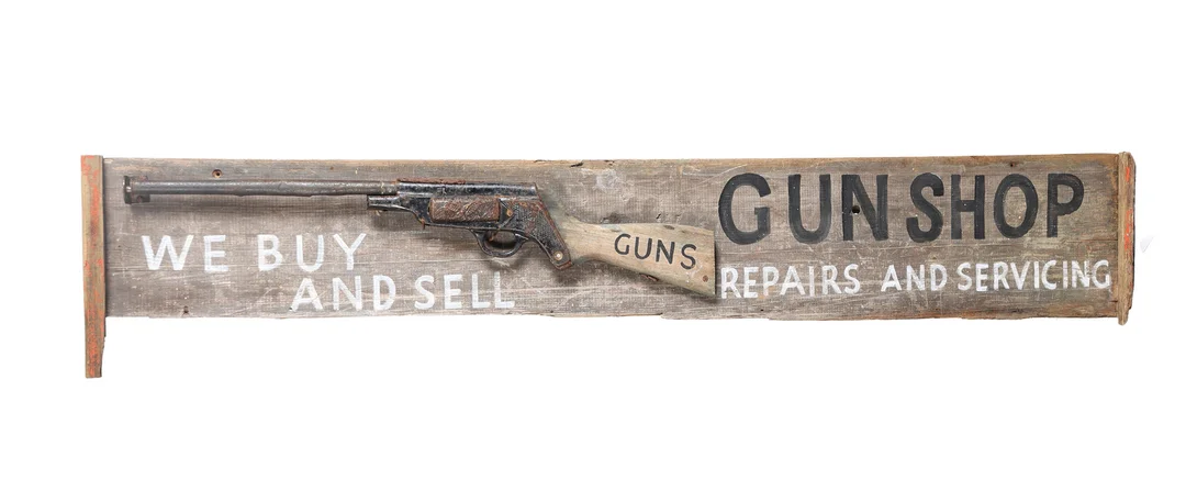 A FOLK ART STYLE WOODEN GUN SHOP SIGN. — Other collectables — Bishop & Miller