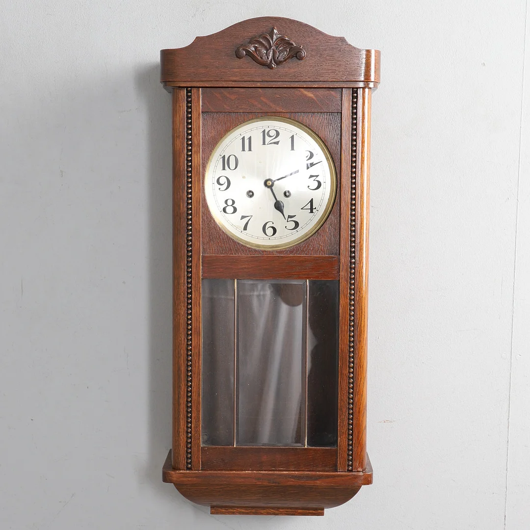 A 1940S OAK CASED WALL CLOCK. — Wall Clocks — Lawrences Auctioneers