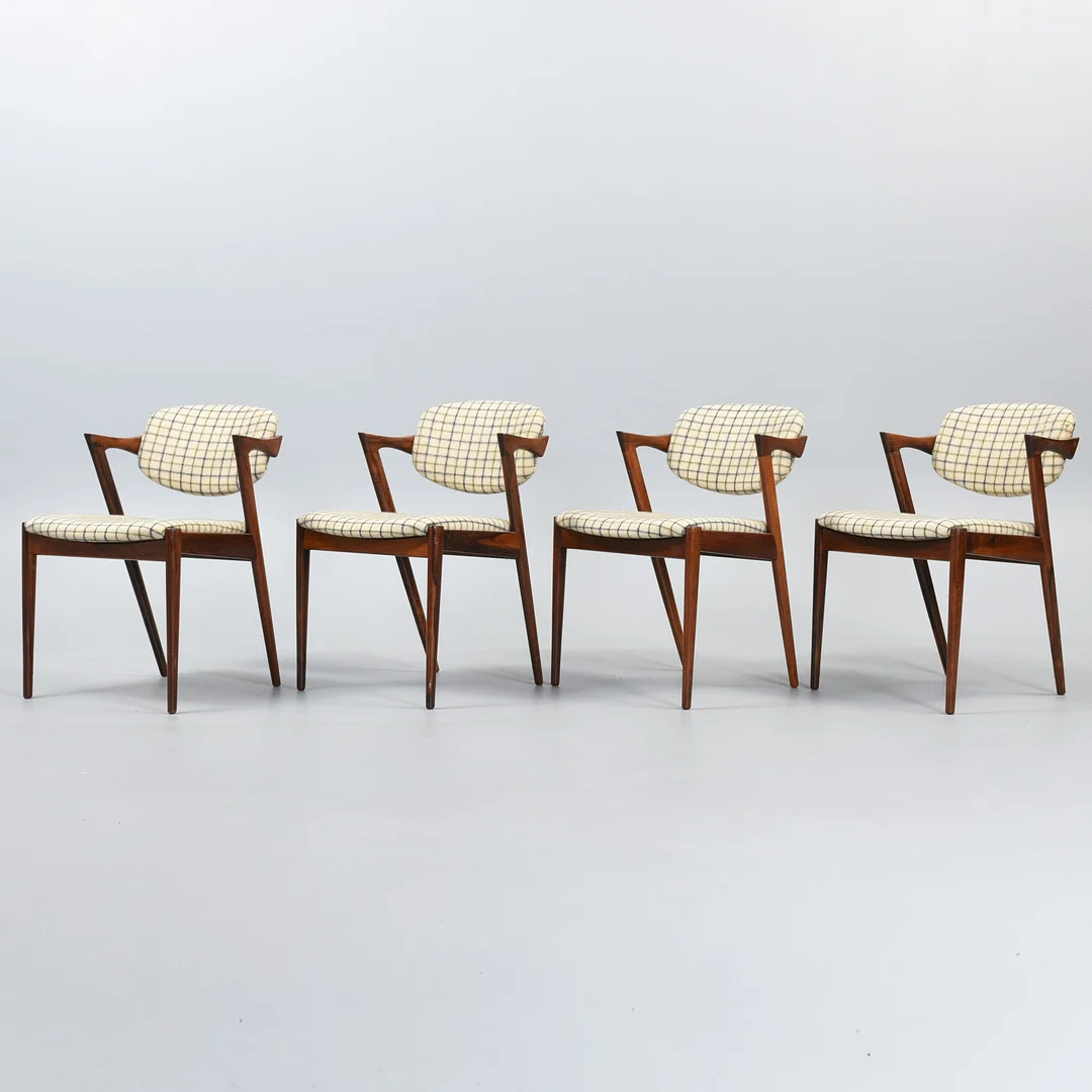 KAI KRISTIANSEN. Sæt af fire stole af palisander, model 42, Danmark, 1970'erne (4). — Armchairs & Chairs — Sørensen Auktioner