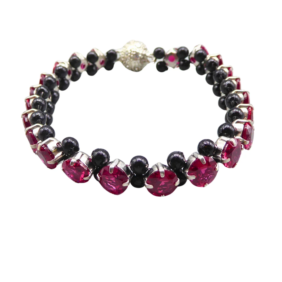 ARMBAND MIT SYNTHETISCHEN STEINEN UND MAGNETVERSCHLUSS. — Bracelets — Auktionshaus Stuber's Hammerschlag