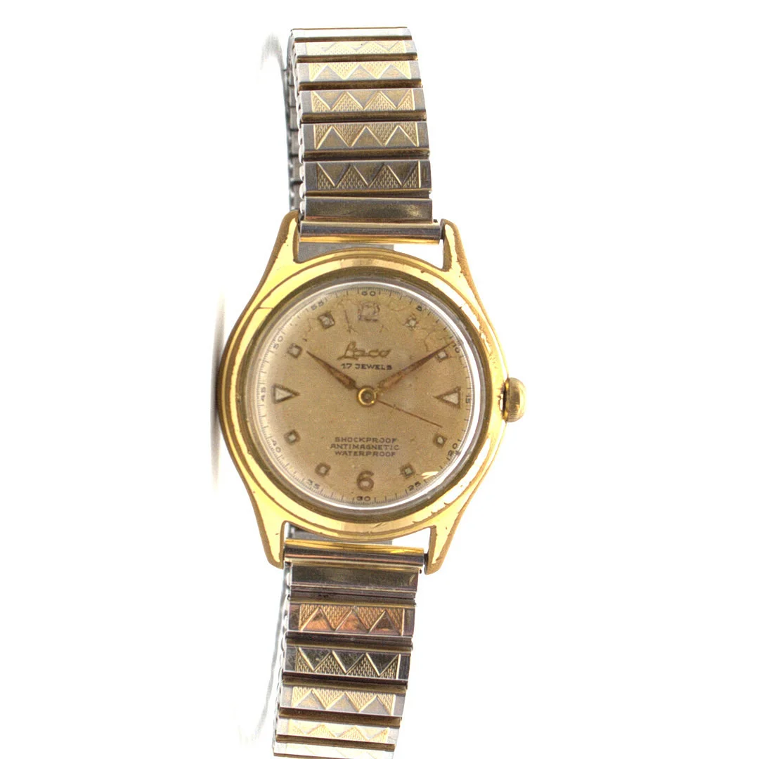 LACO HERRENARMBANDUHR, HANDAUFZUG, VERGOLDETES GEHÄUSE, CHAMPAGNERFARBENES ZIFFERNBLATT; SHOCKPROOF, ANTIMAGNETIC, WATERPROOF UM CA. 1950. — Wristwatches — Kunst- und Auktionshaus Kleinhenz