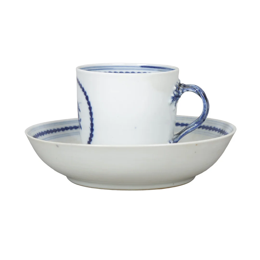 AN 18TH CENTURY ENGLISH PORCELAIN BLUE AND WHITE CUP AND SAUCER (2). — European — Bishop & Miller