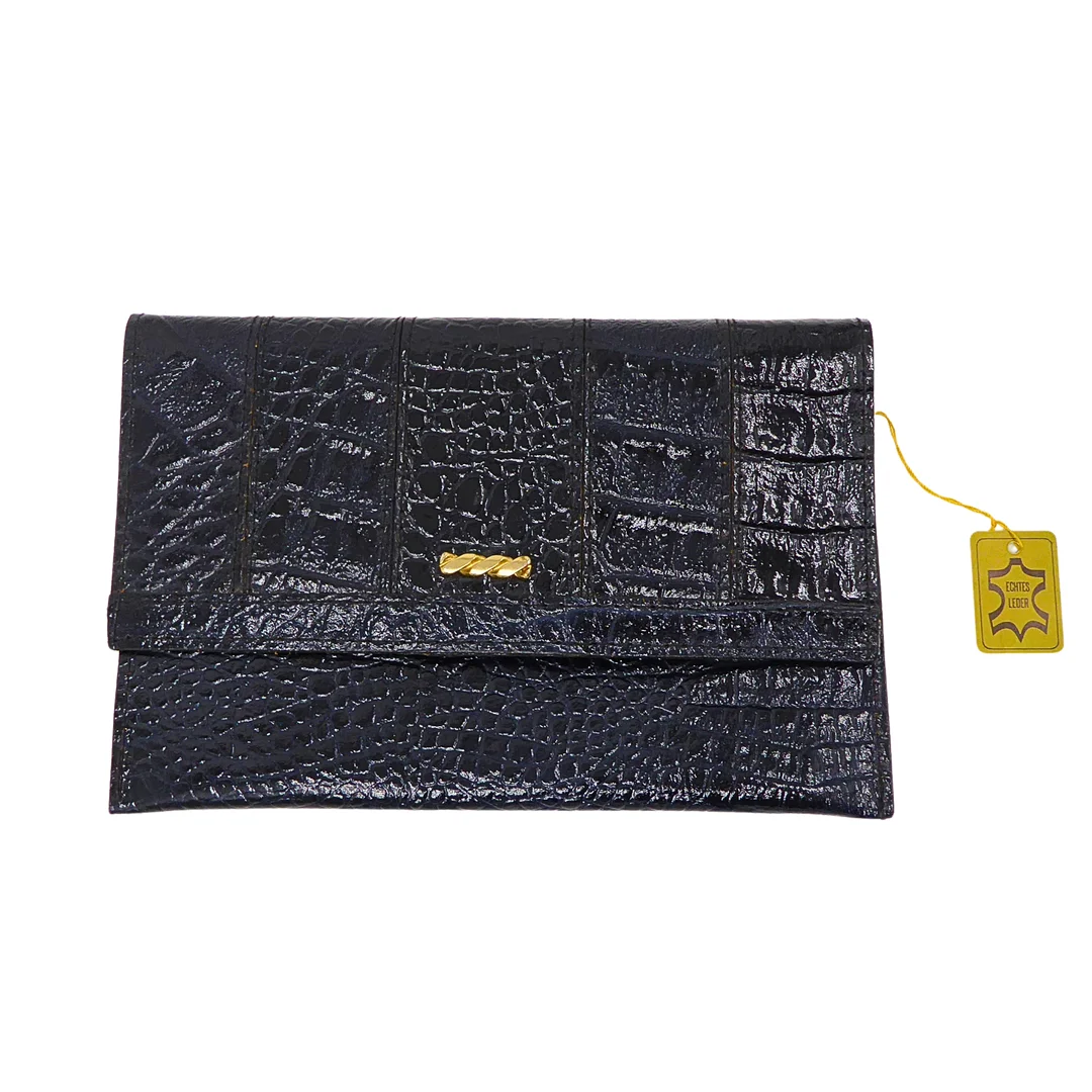 LEDERCLUTCH IN KROKO-PRÄGUNG MIT ECHTHEITSZERTIFIKAT. — Vintage & Designer Fashion — Auktionshaus Stuber's Hammerschlag
