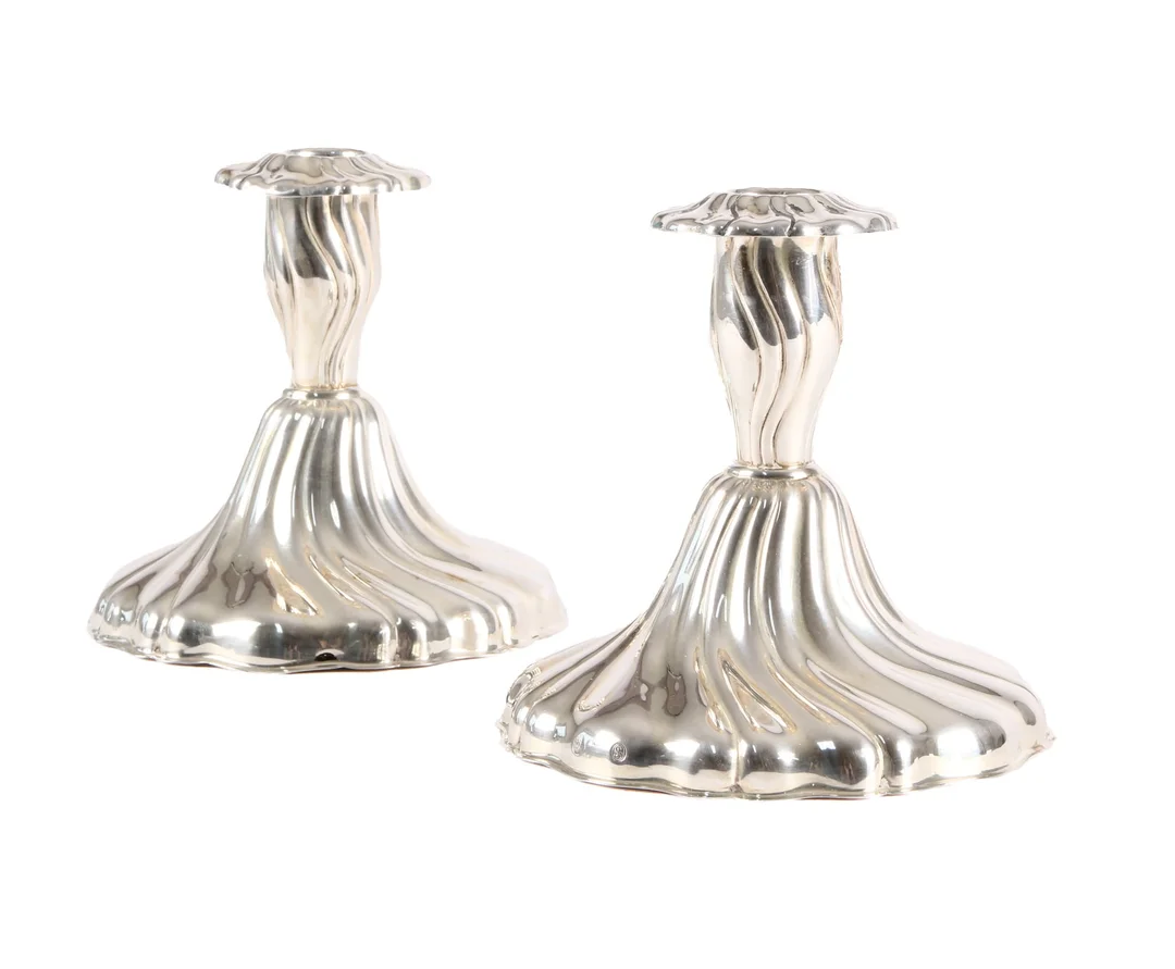 Hans Jensen. Pair of rococo shaped silver candlesticks. (2) — Silver, bronze, copper and pewter/Silver candlesticks — Lauritz