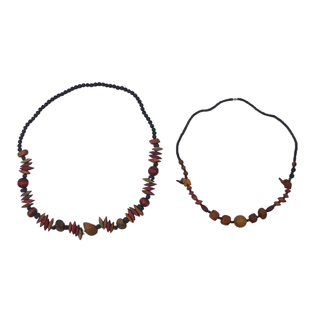 SET AUS ZWEI HOLZPERLENKETTEN. — Necklace — Auktionshaus Stuber's Hammerschlag