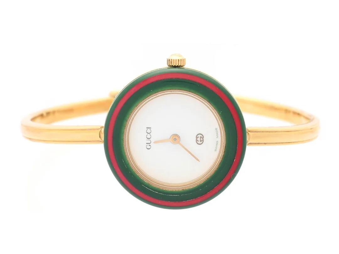 GUCCI, damur, 26 mm, Serie nr. 0511559, Boett nr. 11/12, doublé, quartz, mineralglas, defekt (går ej), 11 st. utbytbara ringar, integrerad originallänk, längd 155 mm, cert, juli 1997, box. — Klockor/Gucci — Kaplans