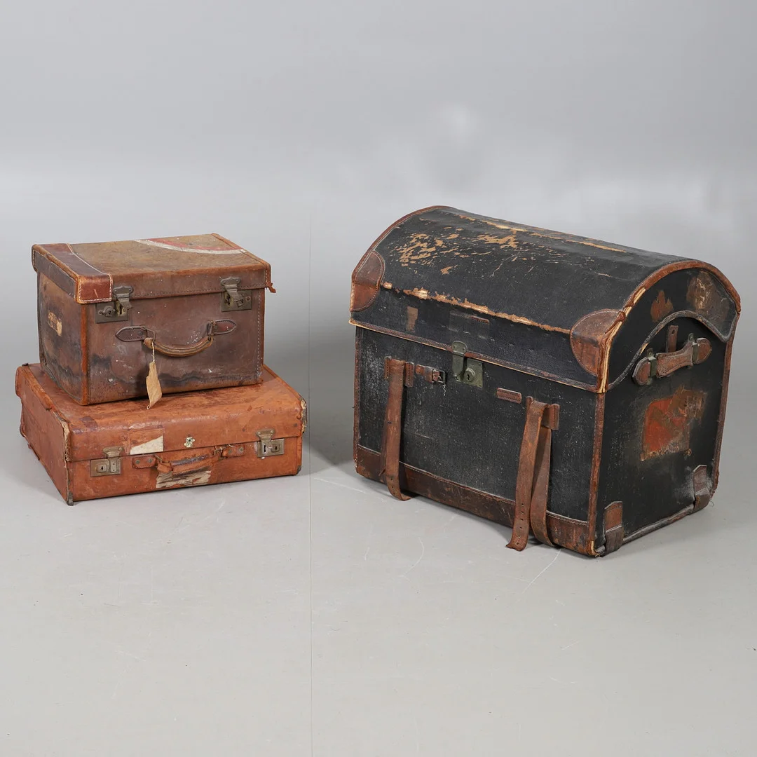 AN EARLY 20TH CENTURY DOME TOP TRAVEL TRUNK; A REV ROBE LEATHER TRAVEL CASE, AND AN EDWARDIAN LEATHER HALF TRUNK (3). — Vintage & Designer Fashion — Lawrences Auctioneers
