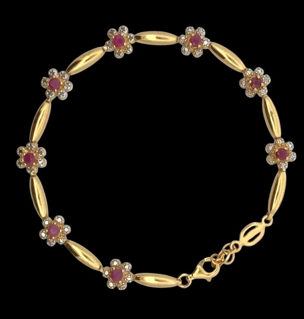 GOLD PLATED SILVER RUBY FLOWER BRACELET. — Bracelets — Griffin’s Auctioneers