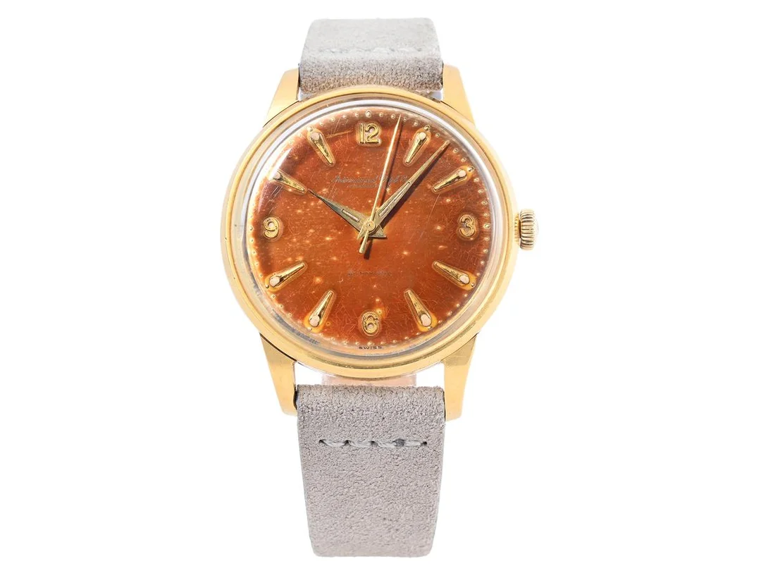INTERNATIONAL WATCH Co, Schaffhausen, s.k. "Tropical Dial", herrur, 36,5 mm, Cal 852, Serie nr. 1330963, Boett nr. 1344539, 18K guld, automatisk, plexiglas, läderband, originalspänne i doublé, ca 1954. — Klockor/IWC — Kaplans