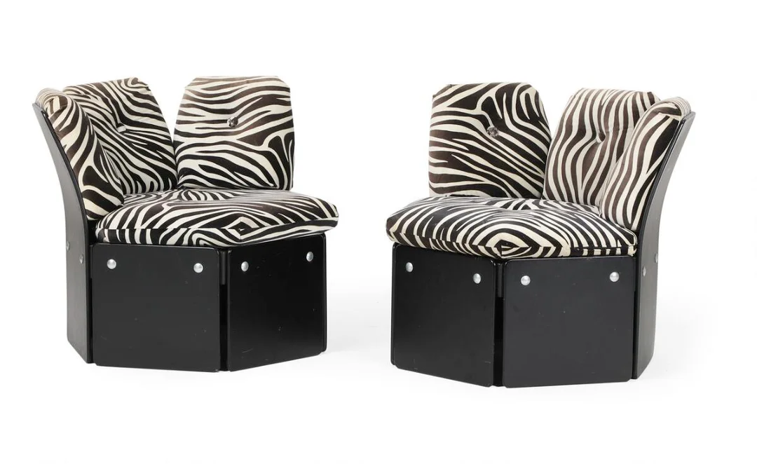Illum Wikkelsø: “Sixtus”. Pair of modular chairs in black lacquered plywood, upholstered in zebra fabric. Manufactured and marked by C. F. Christensen. (2) — Modern Furniture — Bruun Rasmussen