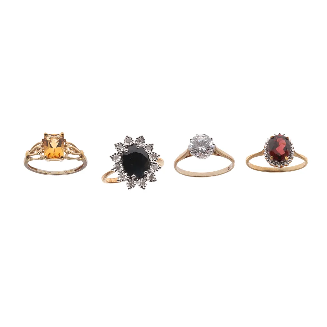 FOUR 9CT GOLD AND GEM SET RINGS. — Rings — Lawrences Auctioneers