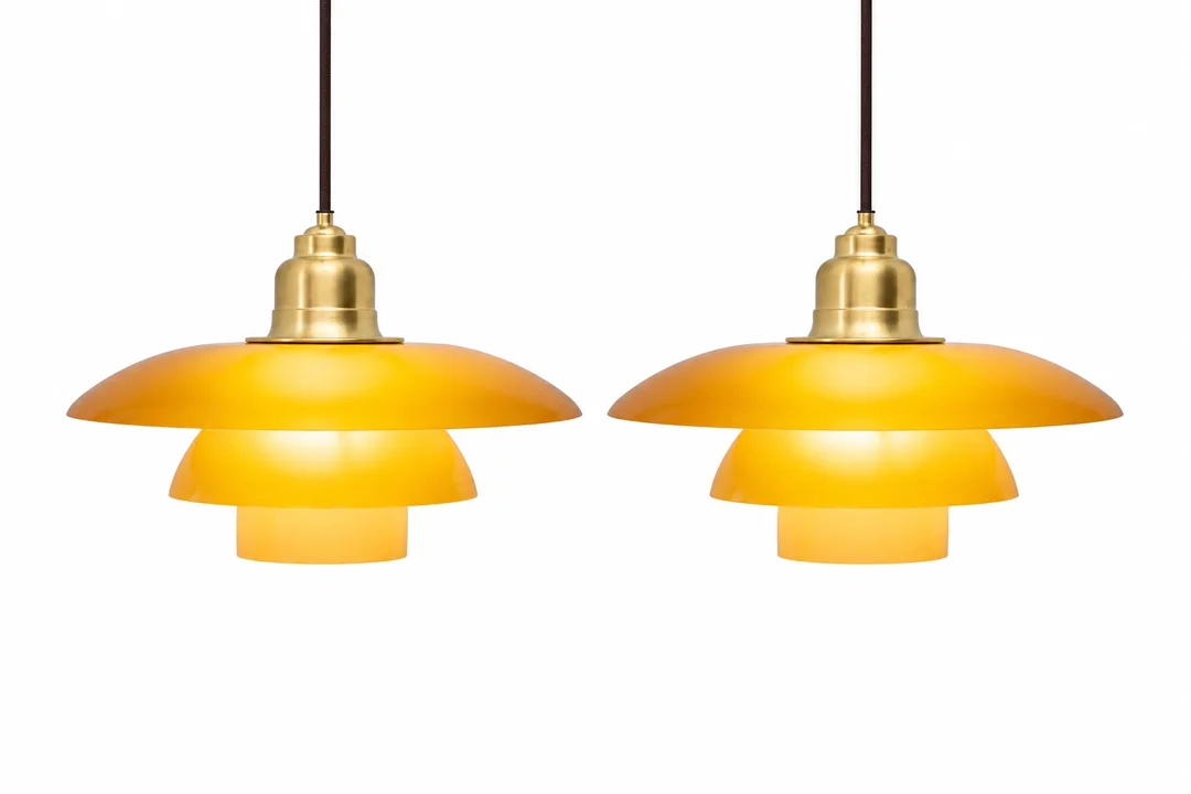 Poul Henningsen / Louis Poulsen, Limited Edition, Pair PH 3½ -3 amber pendant light — Lamps and lighting/Pendant lights — Lauritz