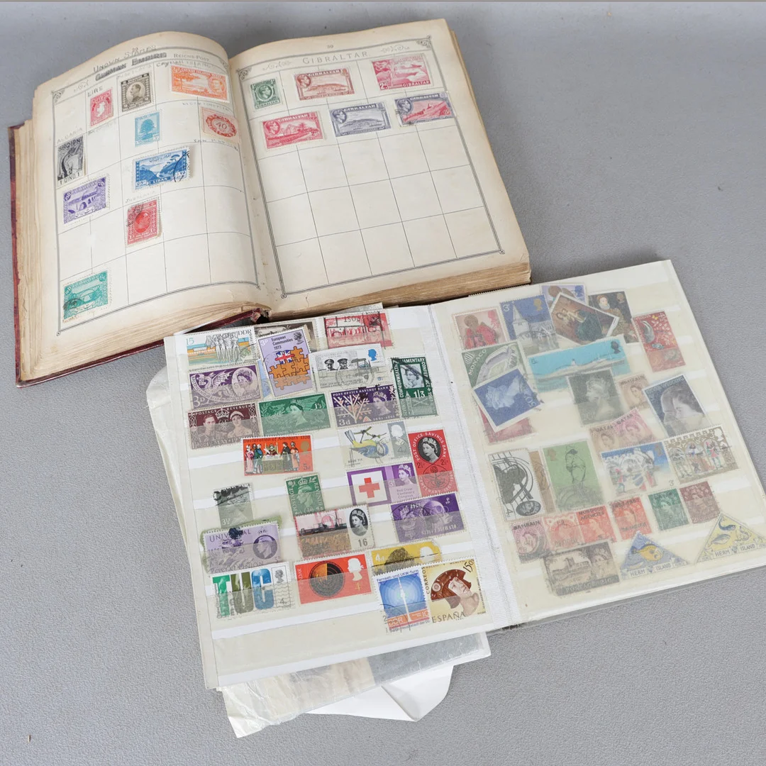 TWO STAMP ALBUMS AND CONTENTS (2). — Stamps — Bishop & Miller