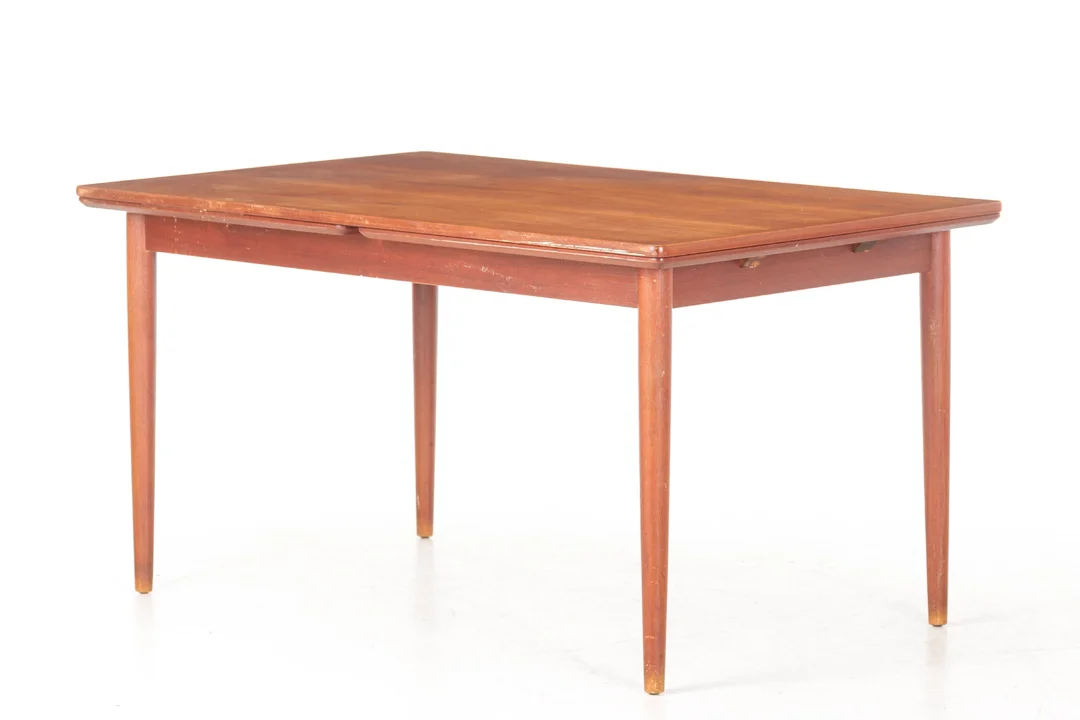 Danish furniture manufacturer. Teak dining table with extension. 1950s/60s. — Furniture/Dining tables, dining room furniture — Lauritz