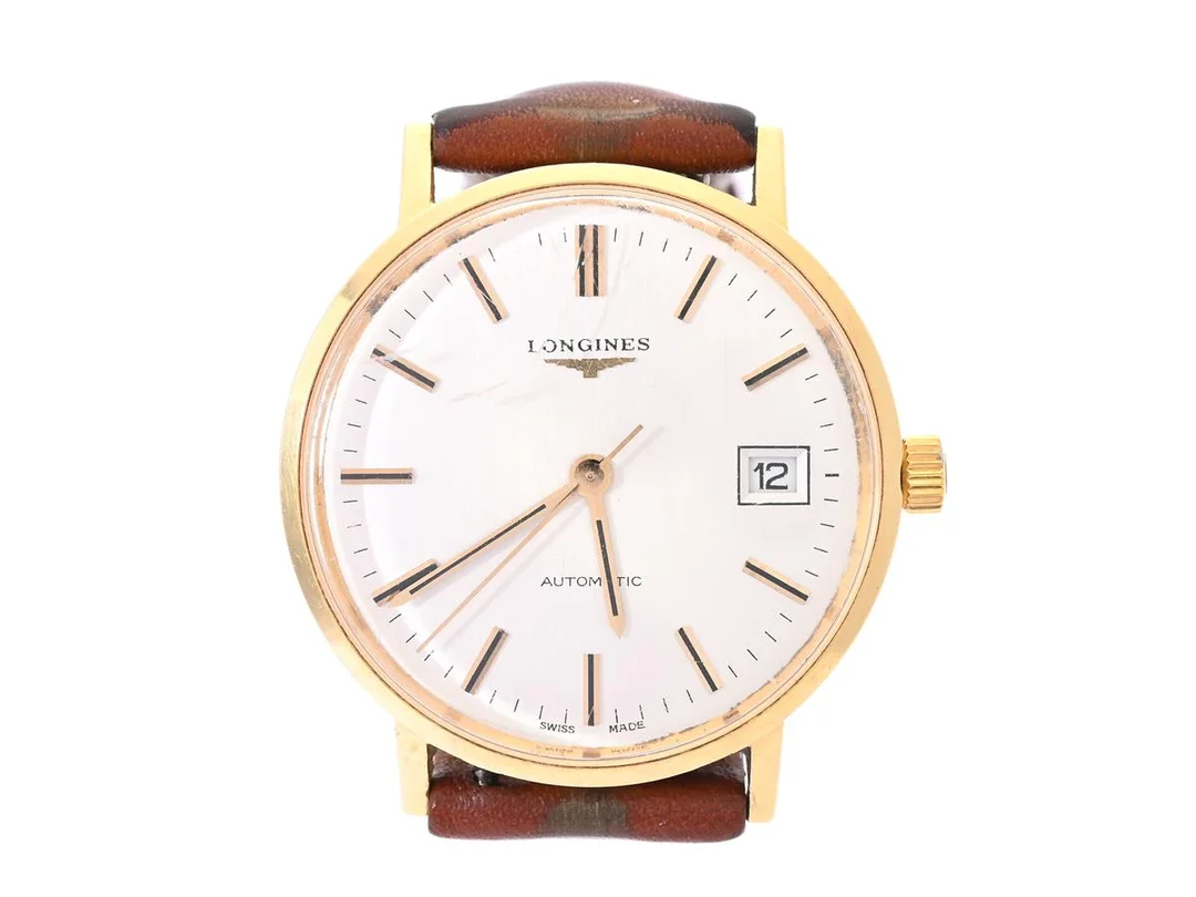 LONGINES, herrur, 35 mm, Cal L633, Serie nr. 52990054, Boett nr. 18077727 / 1603 633, 18K guld, automatisk, plexiglas, datum, gravyr, läderband, ca 1975. — Klockor/Longines — Kaplans