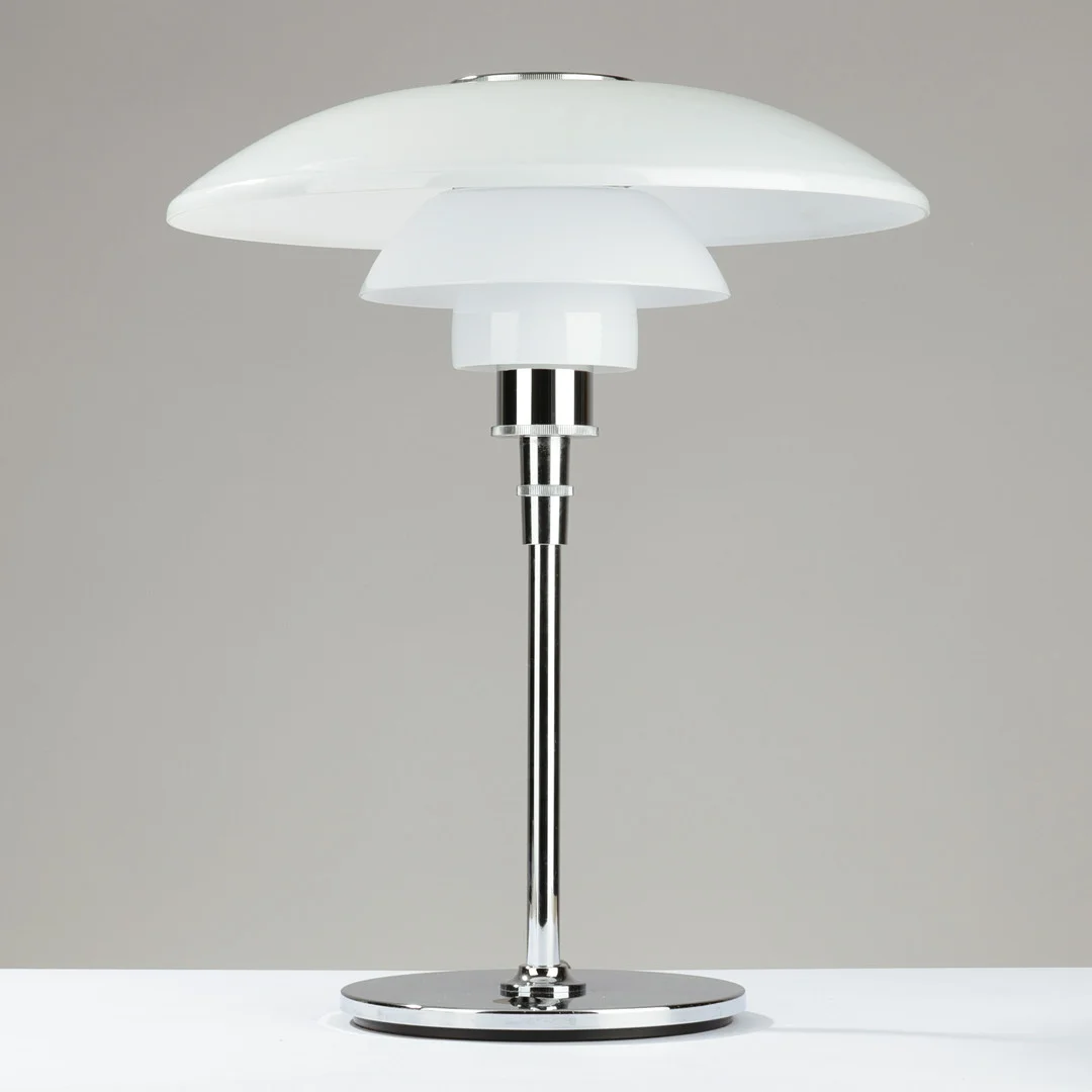 POUL HENNINGSEN. "PH 4,5/3,5", bordlampe af forkromet stål med skærme af flerlags opalglas, Louis Poulsen, model introduceret i 1990. — Table Lamps — Palsgaard Kunstauktioner