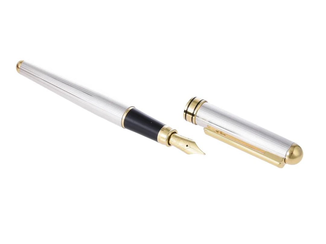 SETTELAGHI, reservoarpenna, inplastad, sterlingsilver/gulmetall, längd 14,8 cm, extra bläck, certifikat, box. — Accessoarer/Pennor — Kaplans