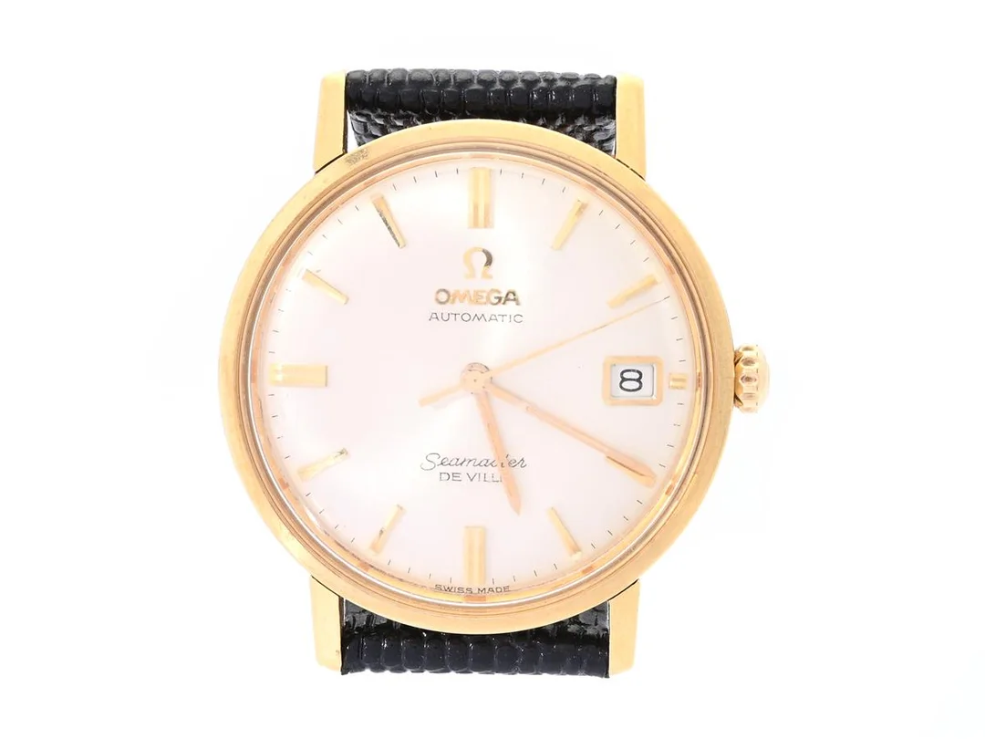 OMEGA, Seamaster, De Ville (Swiss Made), Cal 562, Serie nr. 20065089, Ref nr. BA 166.020, Boett nr. 166020 SC-62, herrur, 34 mm, 18K guld, automatisk, plexiglas, datum, läderband, ca 1962. — Klockor/Omega — Kaplans
