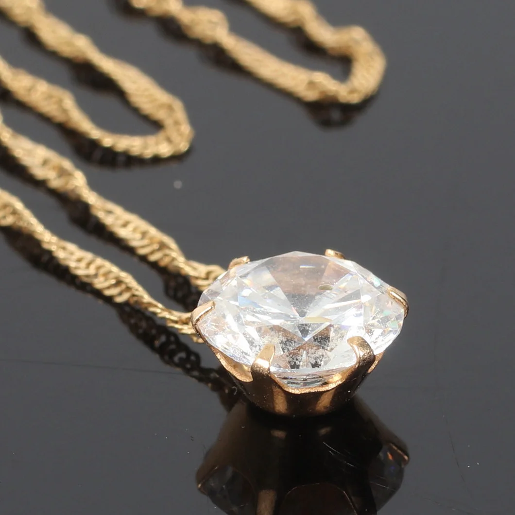 HÄNGE, 18k guld, med bergskristall och HALSKEDJA, 18k guld. 1900-tal. — Brooches & Pendants — Stadsauktion Sundsvall