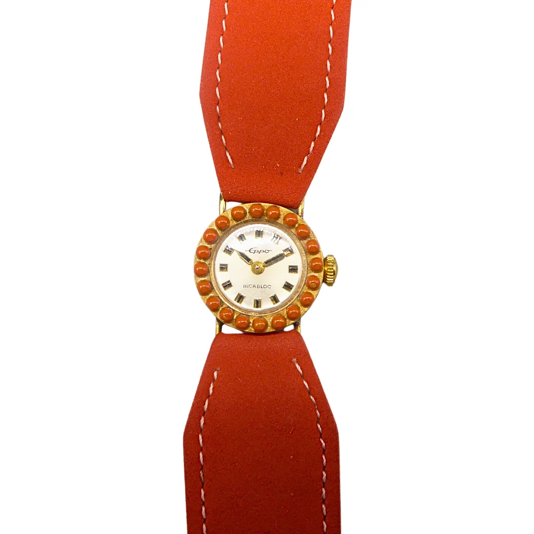 DEUTSCHE DAMEN-ARMBANDUHR EPPO INCABLOC IN KORALLEN-OPTIK. — Wristwatches — Auktionshaus Stuber's Hammerschlag