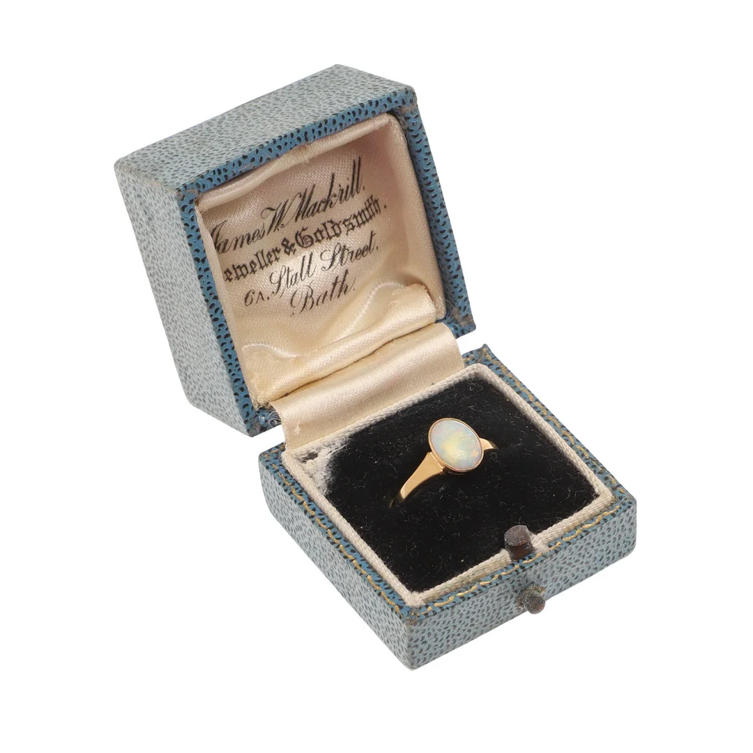 AN OPAL AND 18CT GOLD RING. — Rings — Lawrences Auctioneers