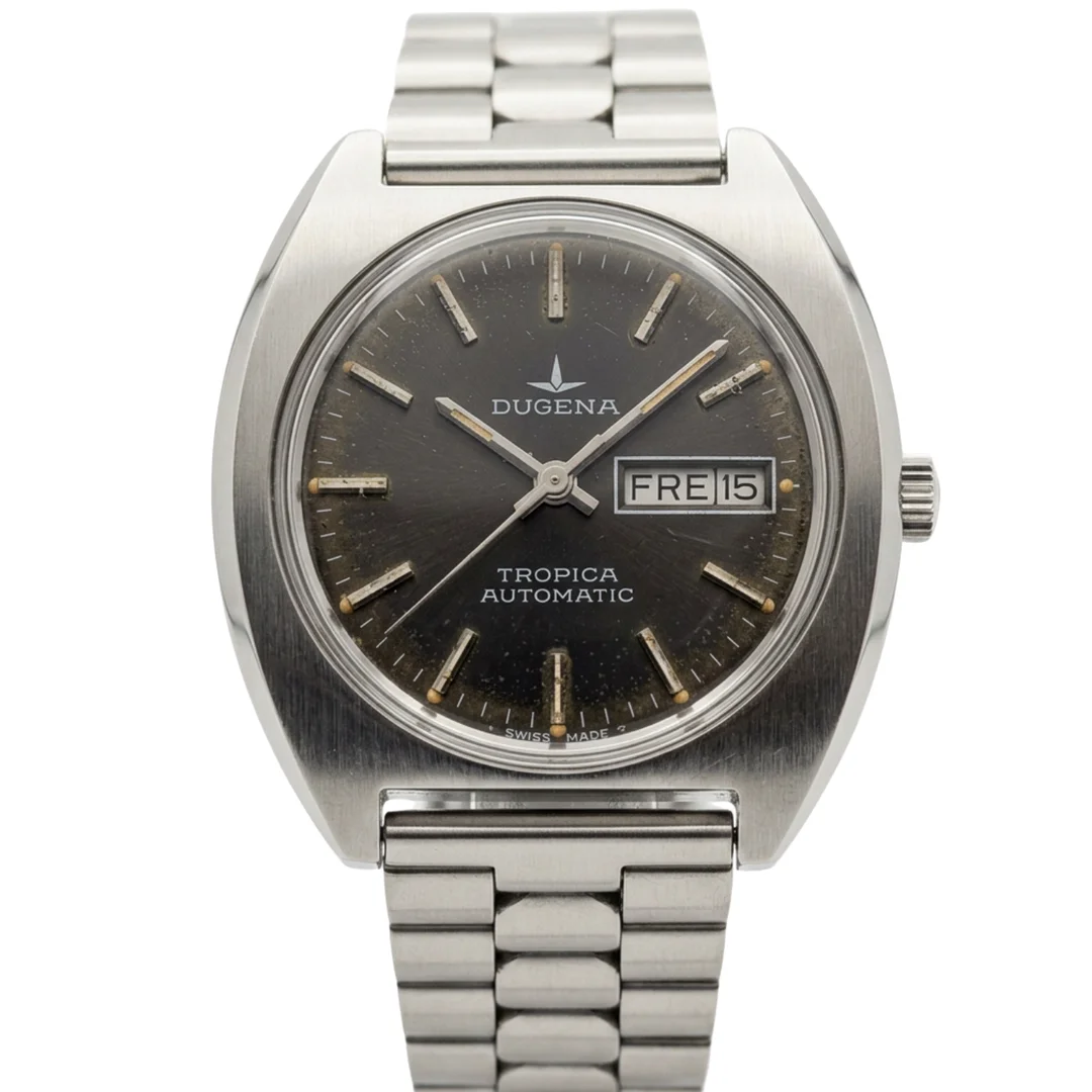DUGENA TROPICA AUTOMATIC ARMBANDUHR MIT DAY-DATE. — Wristwatches — Auktionshaus Stuber's Hammerschlag
