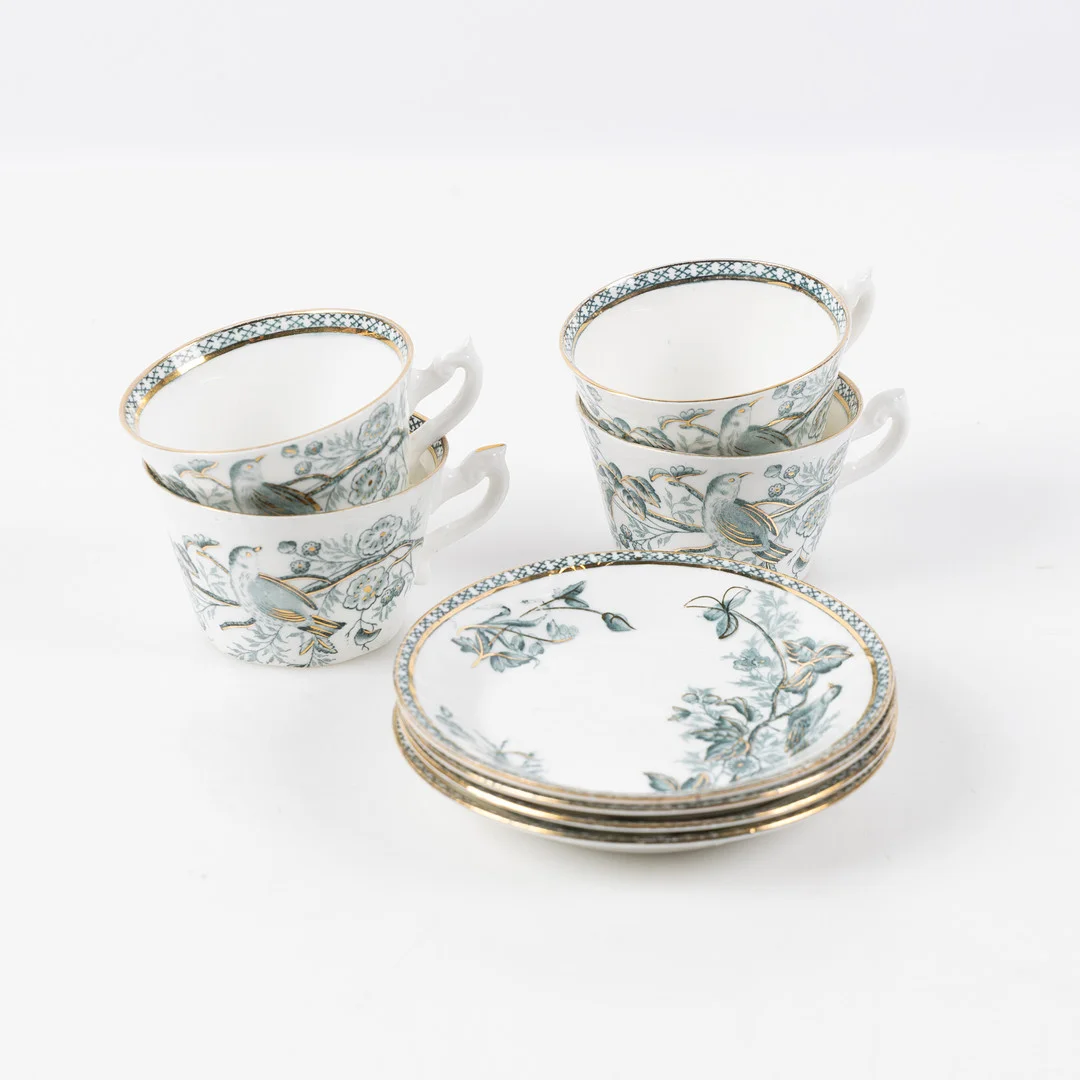 GUSTAFSBERG, 4 kaffekoppar med fat, Wexiö Guld. — Tableware — Stockholms Auktionsverk Helsingborg