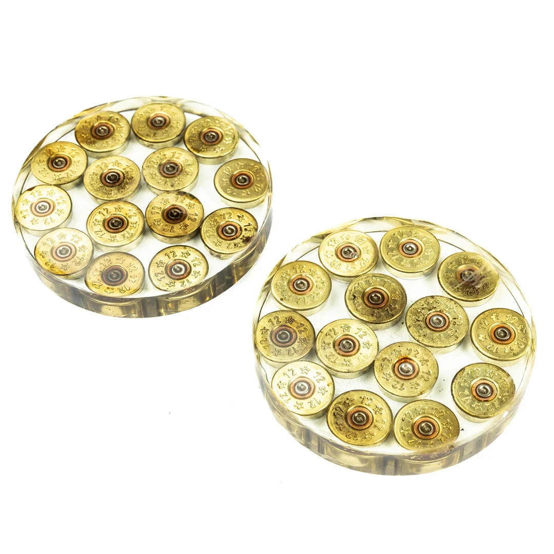 PAIR OF RESIN COASTERS - SHOTGUN CAPS SET INSIDE. — Guns & Rifles — Griffin’s Auctioneers