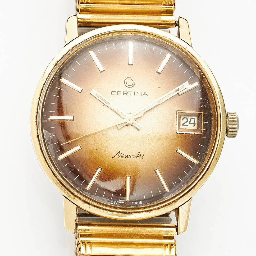 CERTINA, "New Art", armbandsur, stål och gulddouble, manuell, datum, plexiglas, bruntonad urtavla, ca tidigt 1970-tal, fixoflex armband, oädel metall. — Wristwatches — Stockholms Auktionsverk Magasin 5