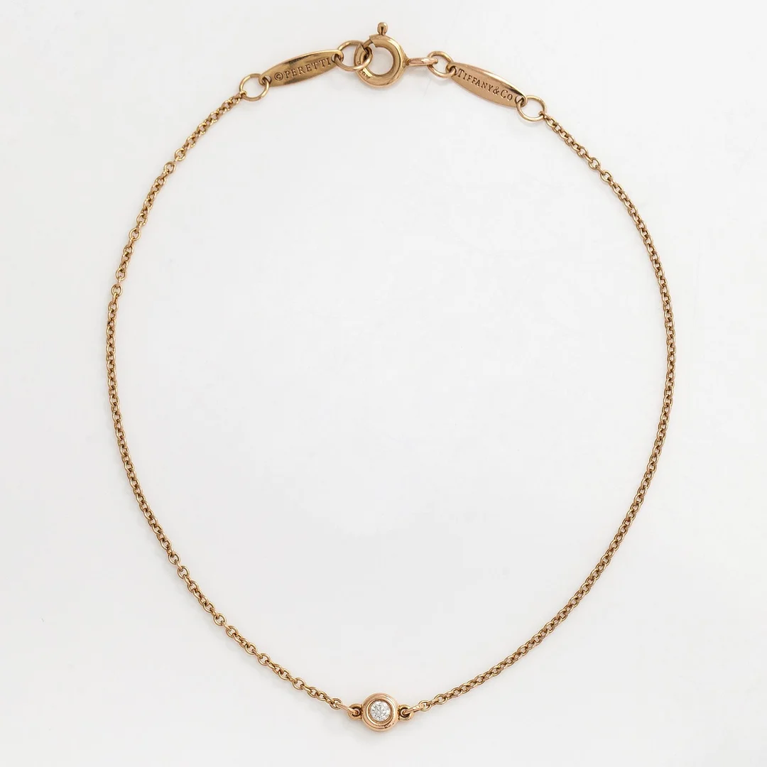 Tiffany & Co, Elsa Peretti, armband, "Diamonds by the Yard", 18K guld med en diamant. — Smycken/Armband — Bukowskis