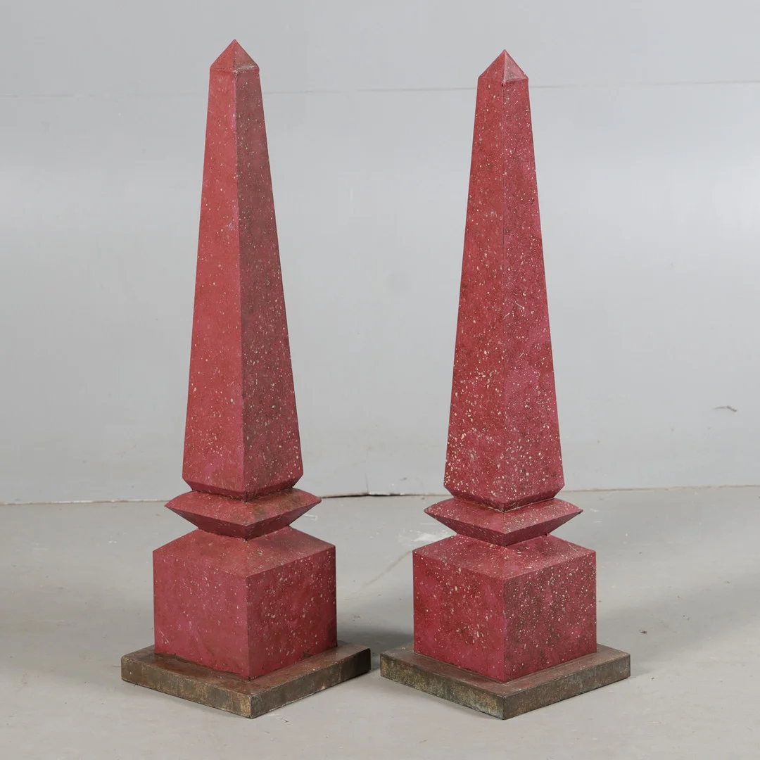 A LARGE PAIR OF FAUX ROUGE MARBLE METAL PAINTED OBELISKS (2). — Miscellaneous — Bishop & Miller