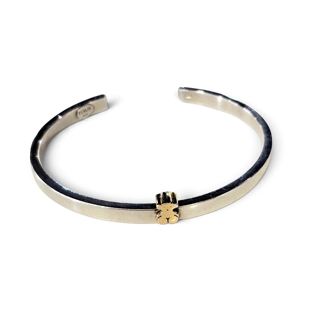 TOUS. Pulsera en plata de Ley con osito chapado en oro amarillo. — Bracelets — Arce Auctions