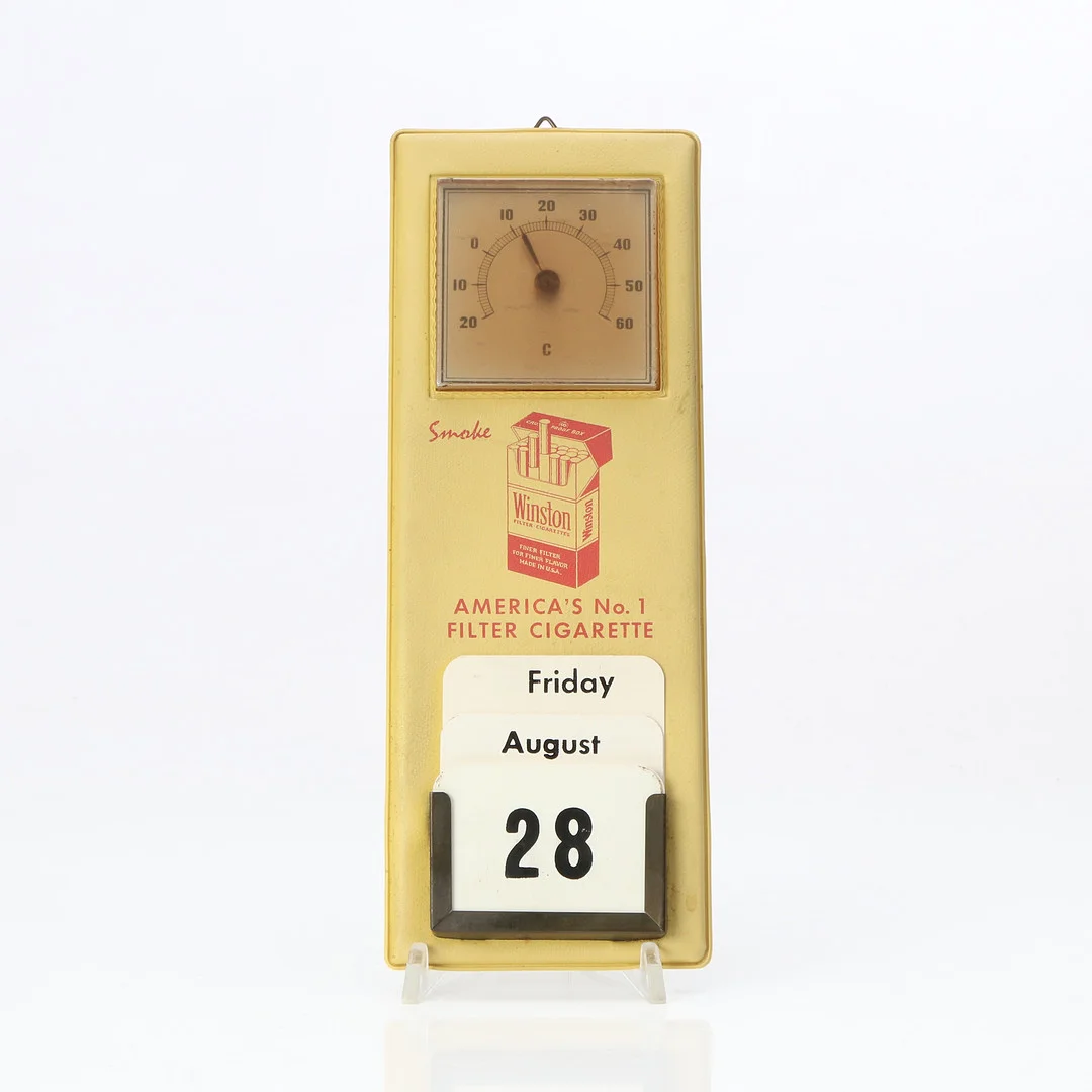 WINSTON, REKLAMSKYLT. Galon, med kalender och termometer. 1900-talets mitt. — Advertising & Signs — Skånes Auktionsverk