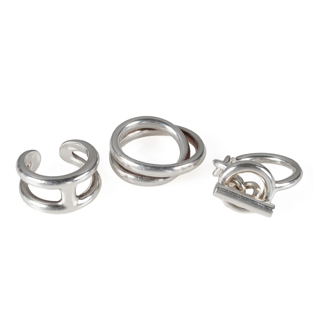 Hermés: A 'Croisette', an 'Osmose' and a 'Vertige' ring of sterling silver. Size 59. (3) — Jewellery/Rings — Lauritz