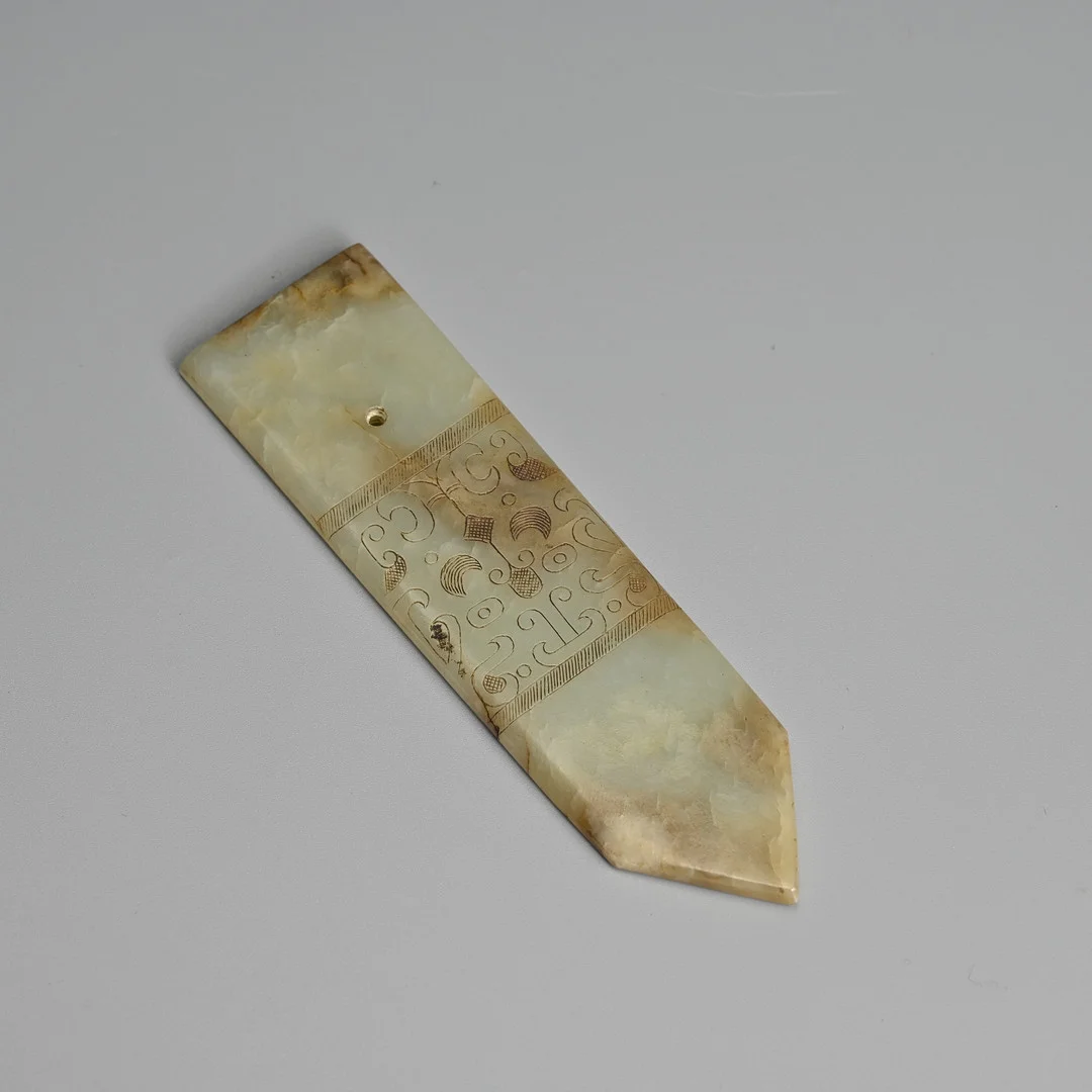 A CHINESE ARCHAISTIC PALE CELADON JADE 'TAOTIE MASK' BLADE, GUI, MING DYNASTY. — Jade — Ma San Auction
