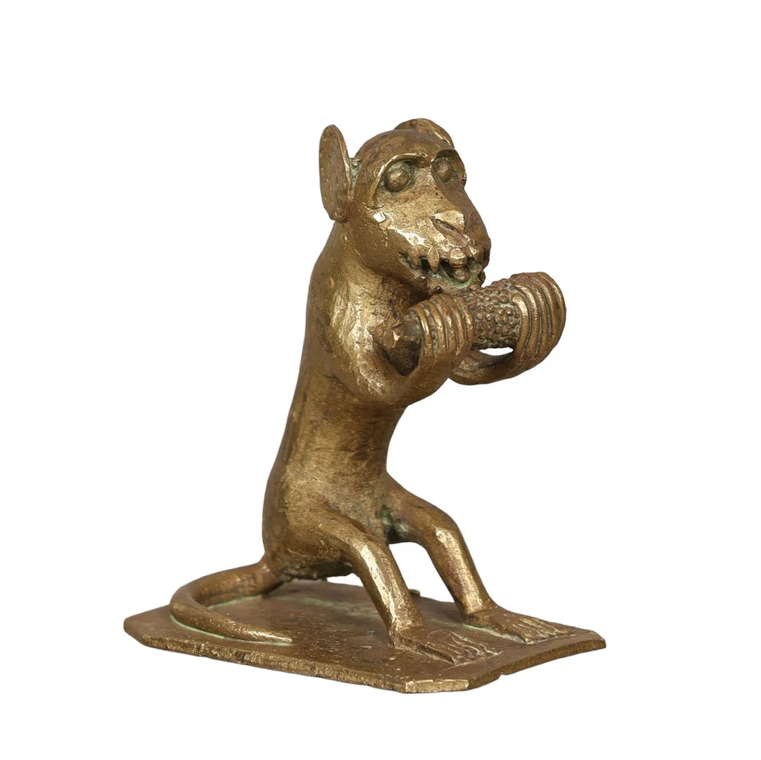 A CAST BRASS MONKEY EATING CORN. — Pewter, Brass & Copper — Bishop & Miller