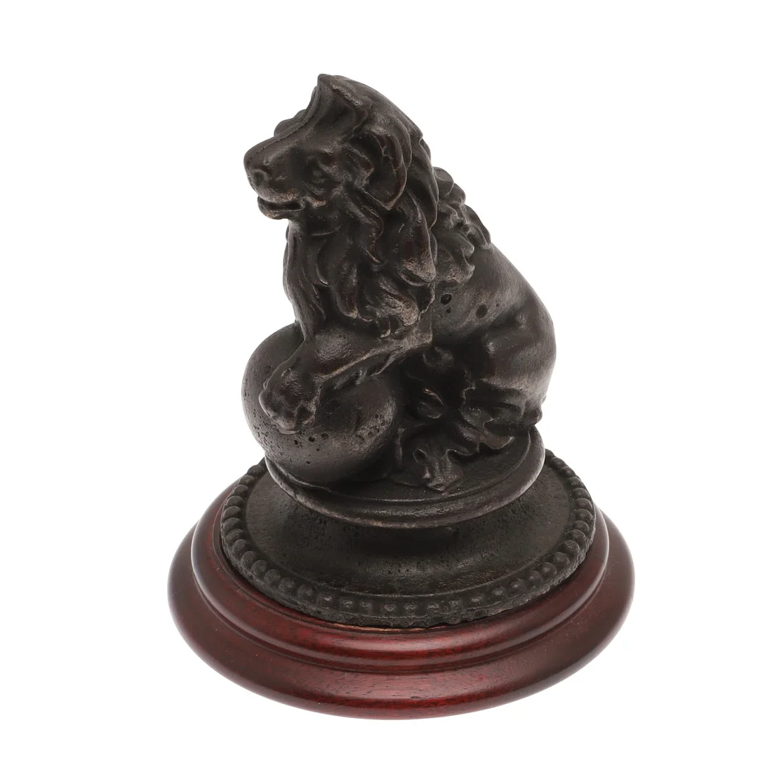 A CAST IRON LION GATE POST FINIAL. — Other metals — Lawrences Auctioneers