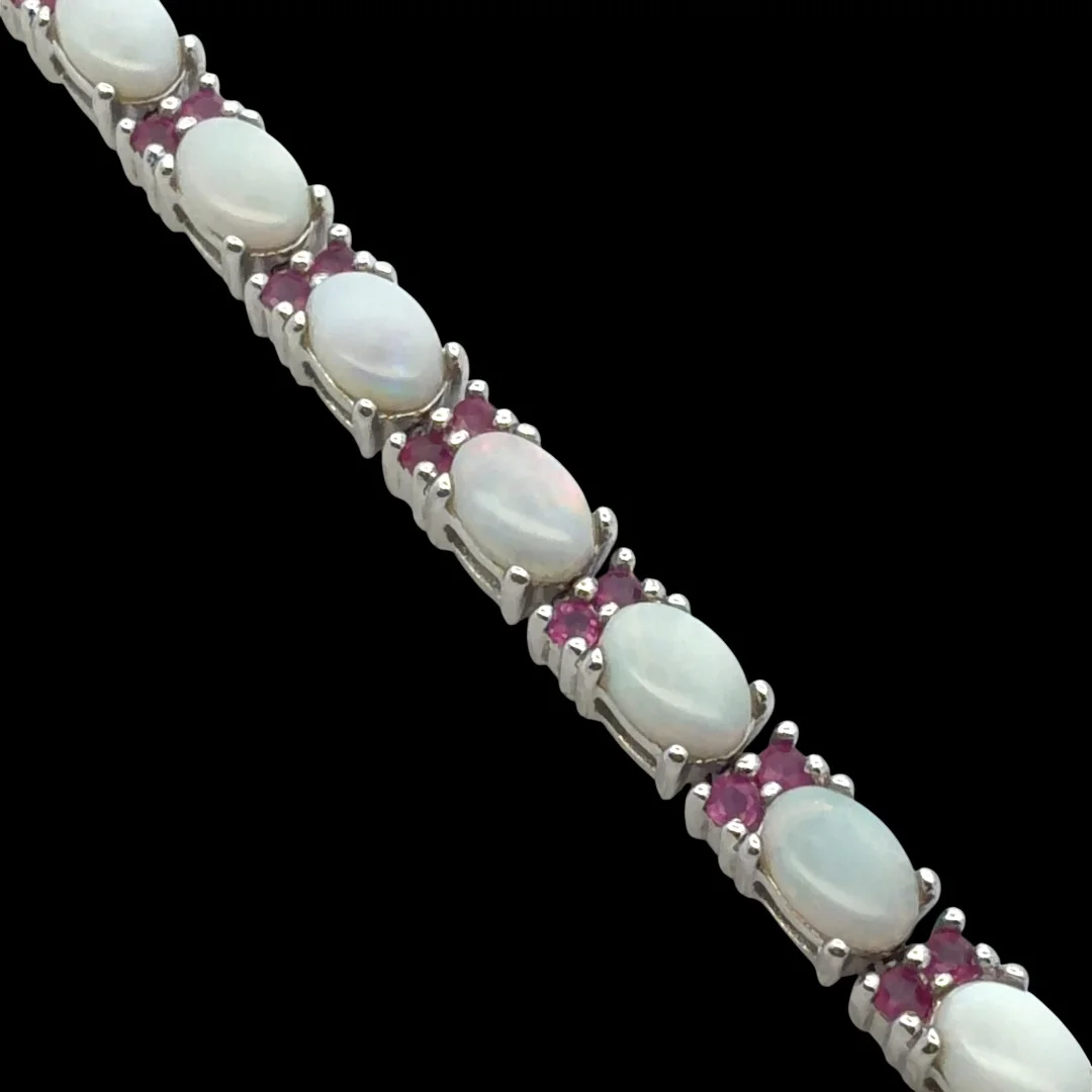 OPAL AND RUBY SILVER BRACELET. — Bracelets — Griffin’s Auctioneers