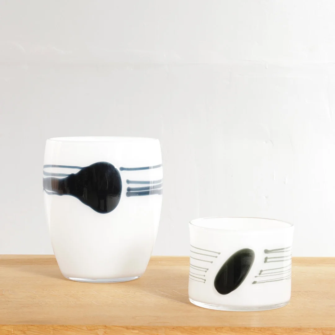 MICHAEL BANG (F. 1944, D. 2013). "Sort plet og streg", to vaser af opal med hvidt glas overfang. Udført hos Holmegaard Glasværk for Royal Copenhagen (2). — Art glass — Woxholt Auktionshus