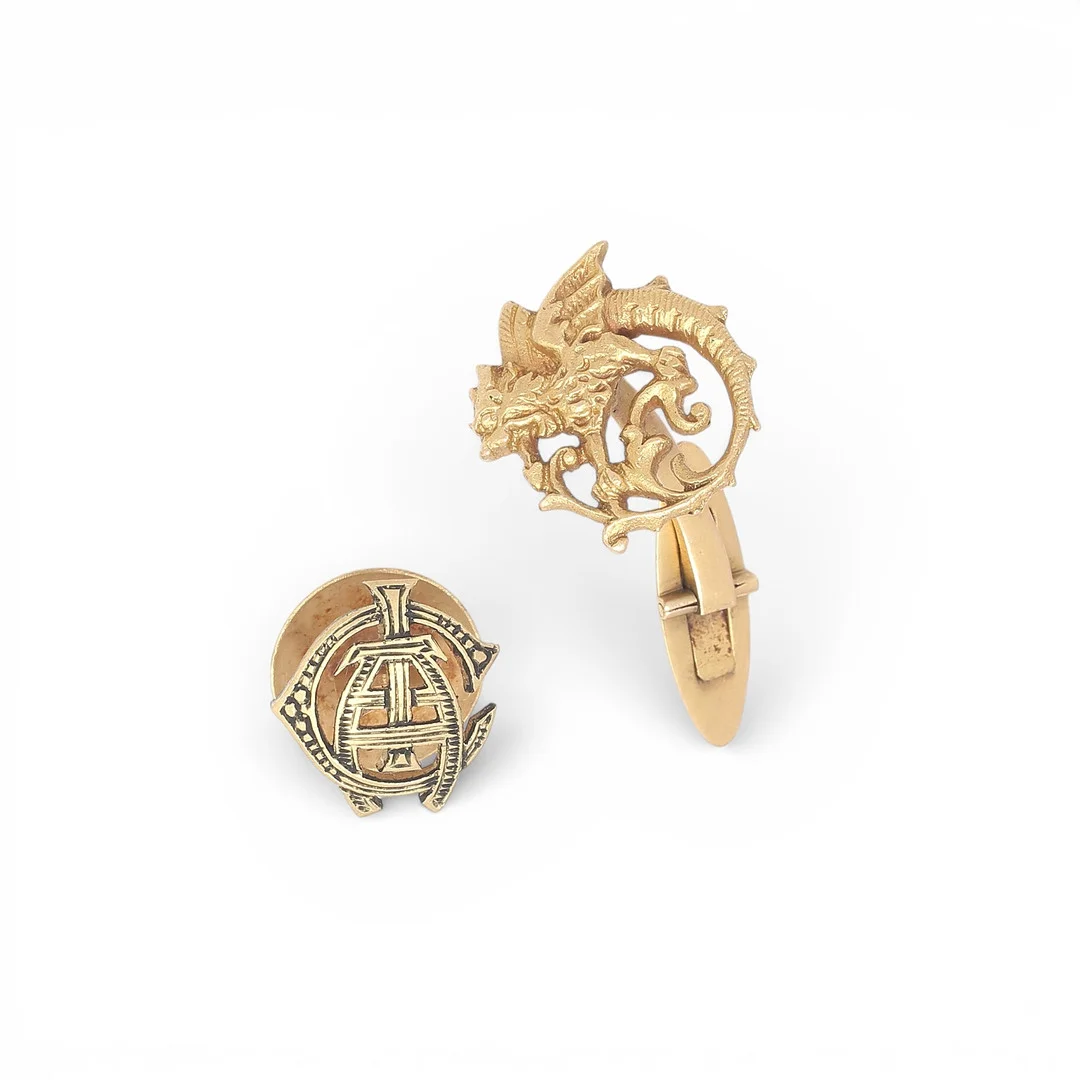 A Modernist dragon-shaped cufflink and a gold button, early 20th Century. — Cufflinks & Tie Pins — Balclis