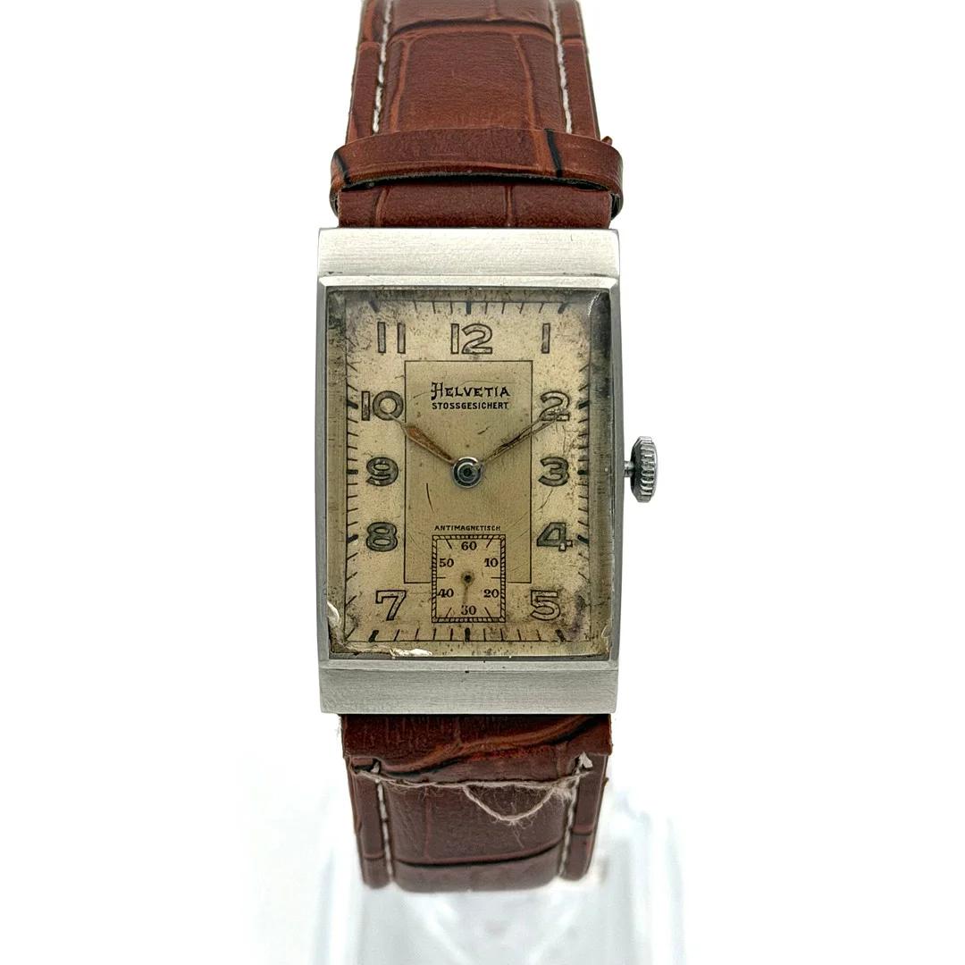 HELVETIA STOSSGESICHERT, armbandsur, art deco, 1930/40-tal, manuell, stål. — Wristwatches — Skandia Auktion