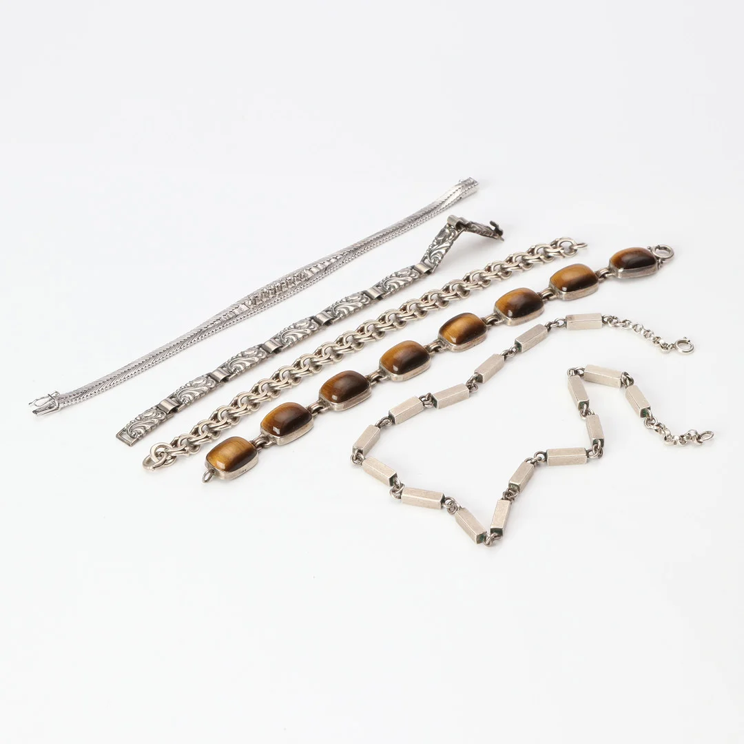 ARMBAND, FEM ST. Silver med tigeröga mm. — Rings — Skånes Auktionsverk
