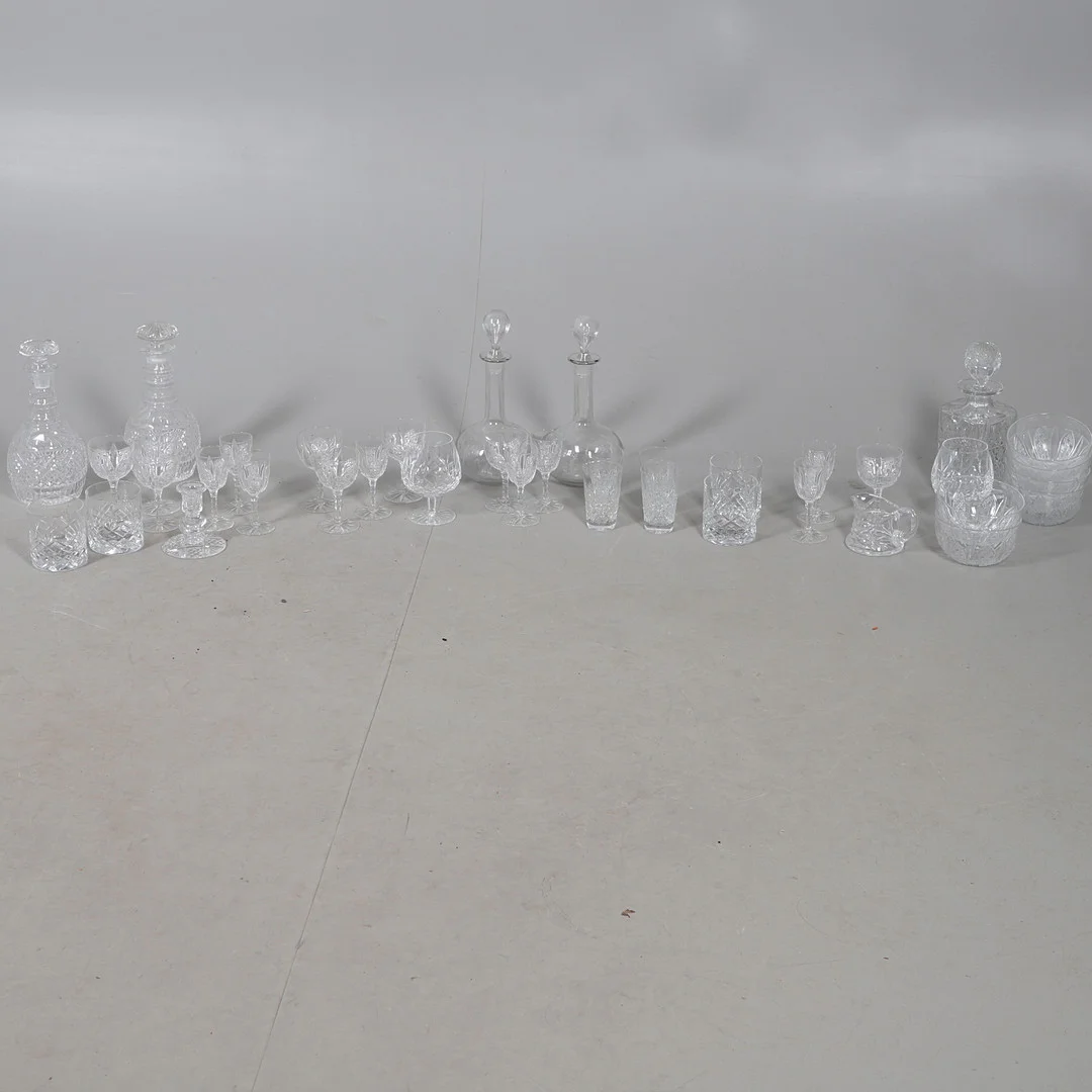 A COLLECTION OF CUT GLASS DECANTERS AND GLASSES. — Tableware — Lawrences Auctioneers