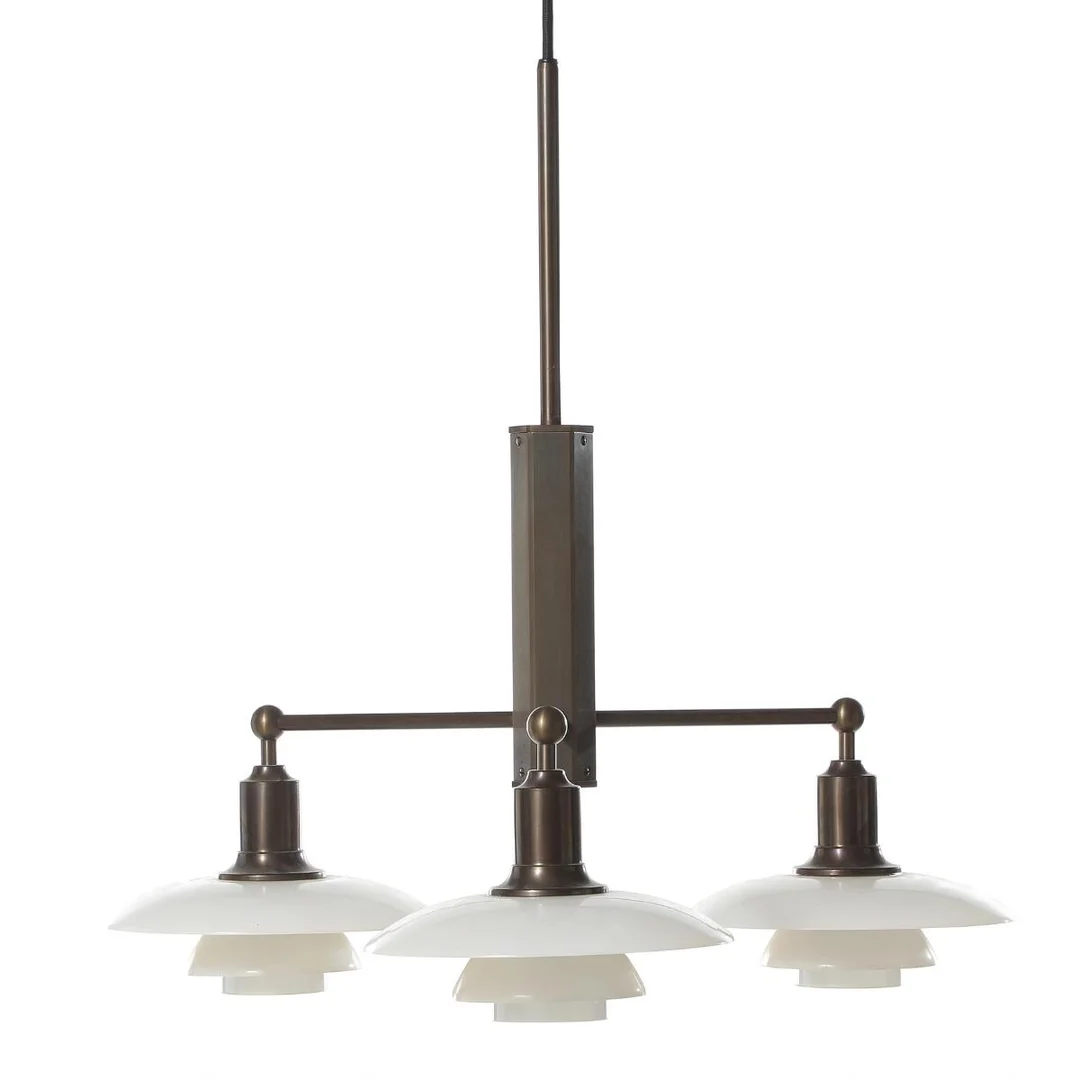 Poul Henningsen: “Stem Fitting”. Brown patinated metal chandelier, three branches with 2/1 opal glass shades. Marked no. 07637. — Modern Lighting — Bruun Rasmussen