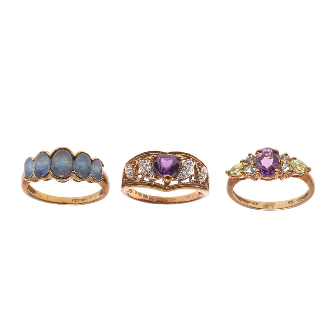 THREE 9CT GOLD AND GEM SET RINGS. — Rings — Lawrences Auctioneers
