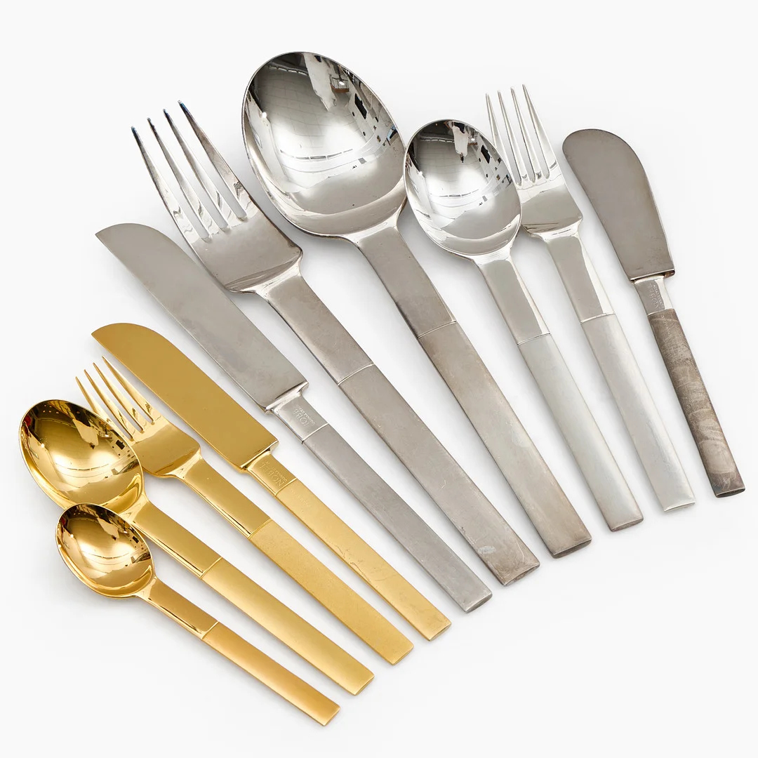GUNNAR CYRÉN. Besticksuppsättning, 66 delar, "Nobel", rostfritt stål, förgyllt och försilvrat, Gense samt Yamazaki, formgiven 1991. — Other metals — Crafoord Auktioner Stockholm