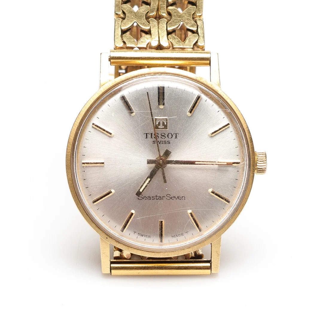 TISSOT, Armbandsur, Seastar Seven, 18k, Guld, mekanisk. — Wristwatches — Gomér & Andersson Linköping