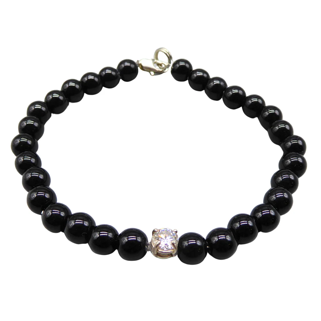 ARMBAND MIT SCHWARZEM ONYX UND EINEM MOISSANITE VON 0,5 CT. — Bracelets — Auktionshaus Stuber's Hammerschlag