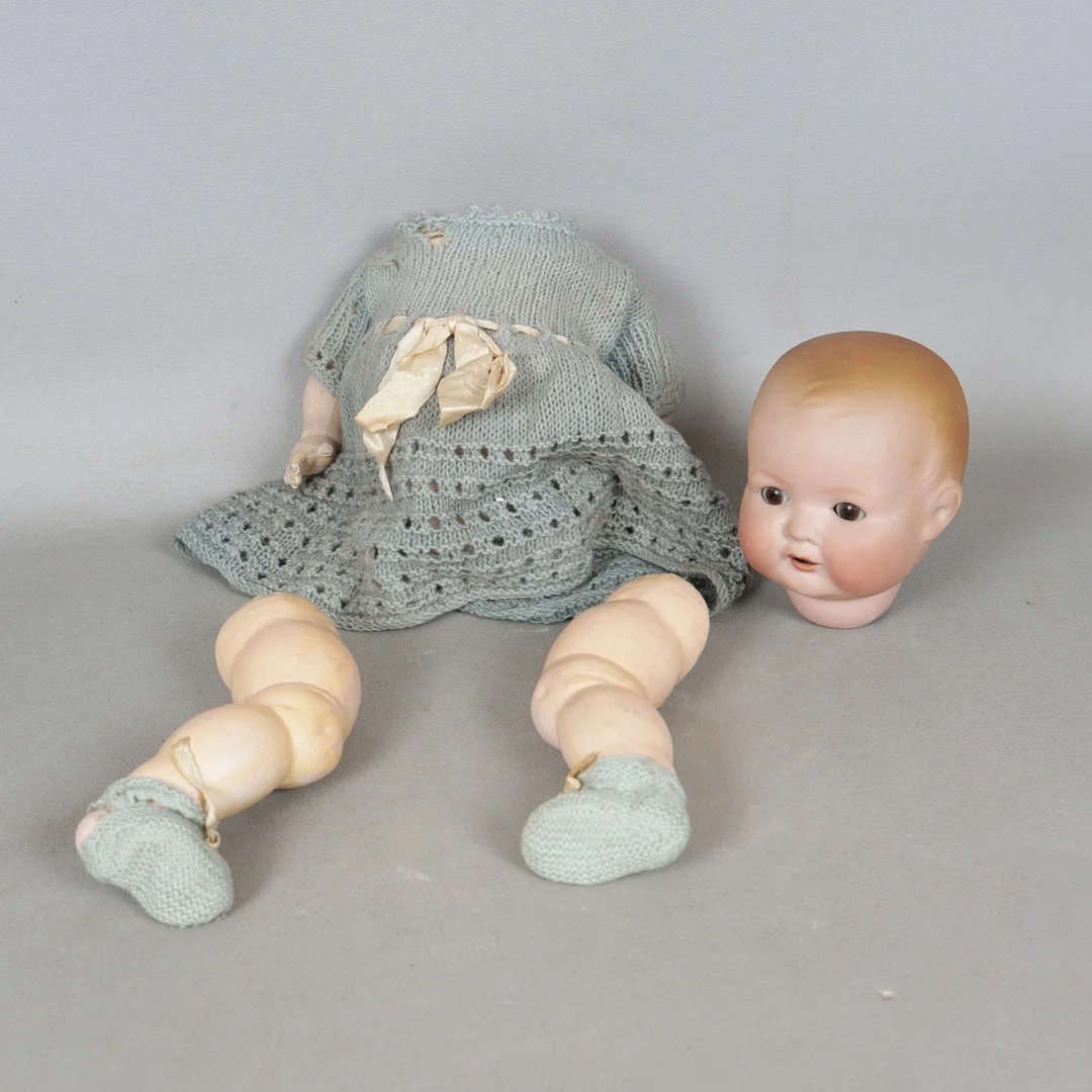 AN ARMAND MARSEILLE BISQUE HEADED DOLL. — European — Bishop & Miller