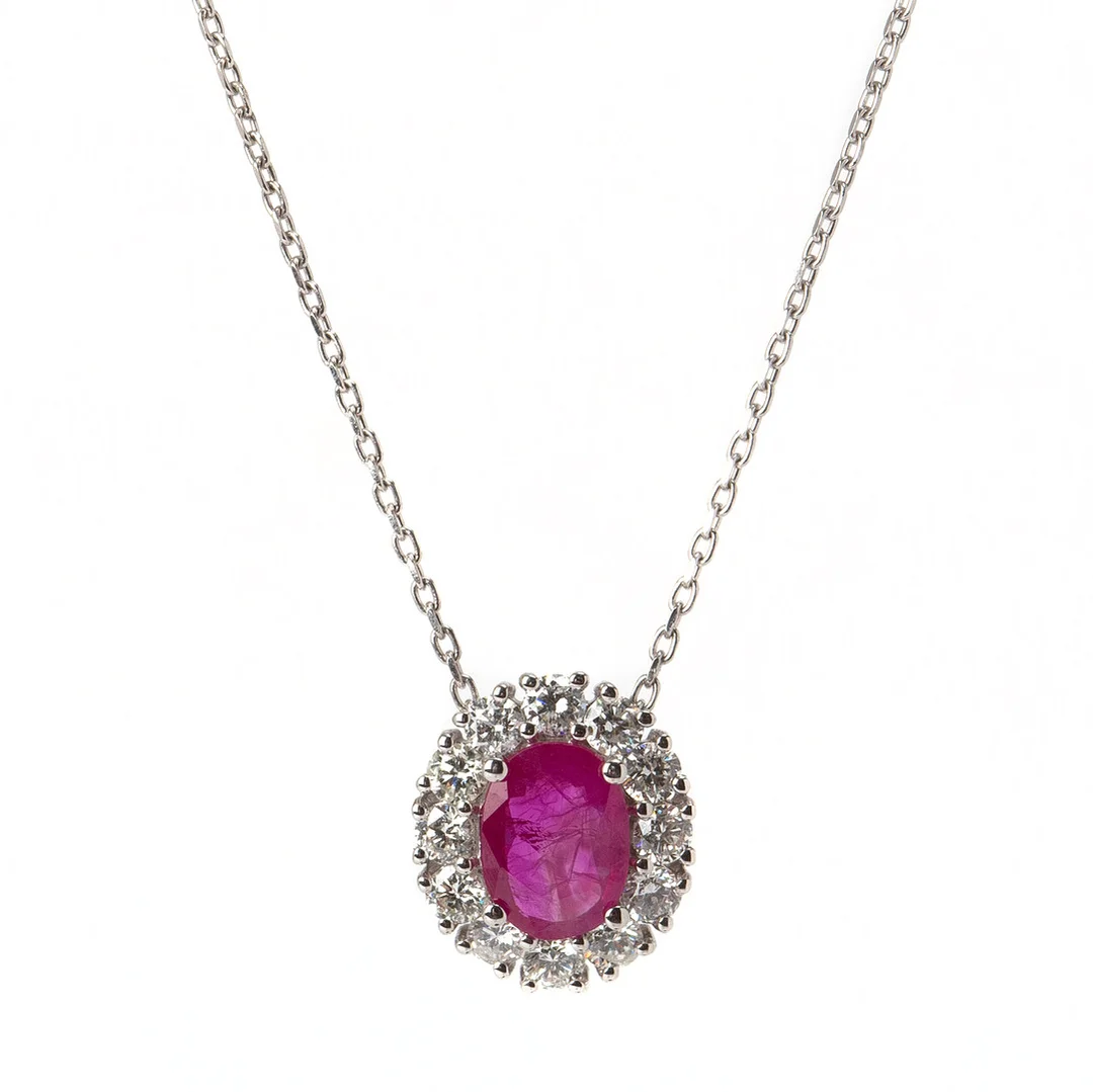HÄNGE, 18K vitguld med briljantslipade diamanter, totalt 0.61 ct samt ovalslipad rubin, 0.87 ct. — Brooches & Pendants — Stockholms Auktionsverk Göteborg